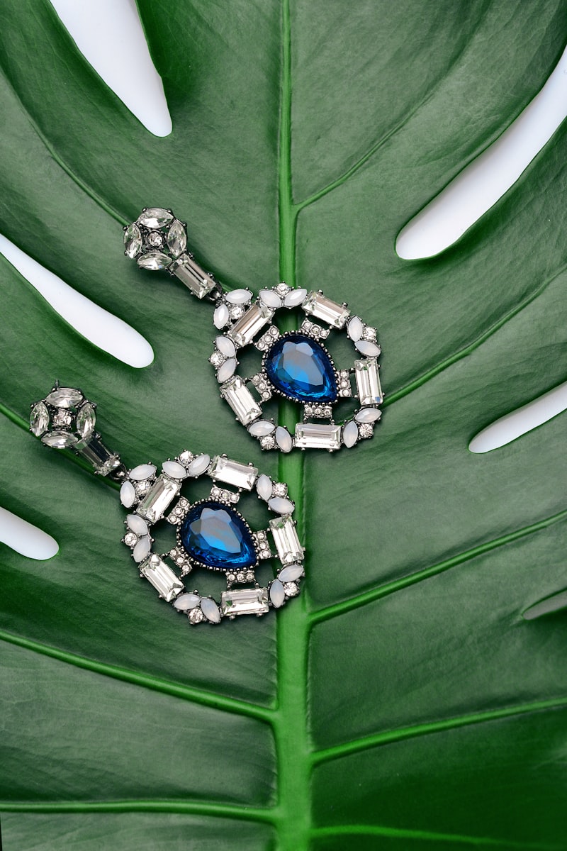 Hands holding emerald jewelry